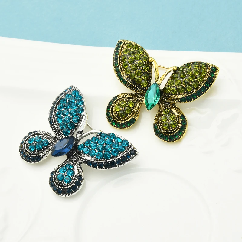 

Wuli&baby Sparkling Rhinestone Butterfly Brooches Women Men Blue Insect Party Office Brooch Pins Gifts