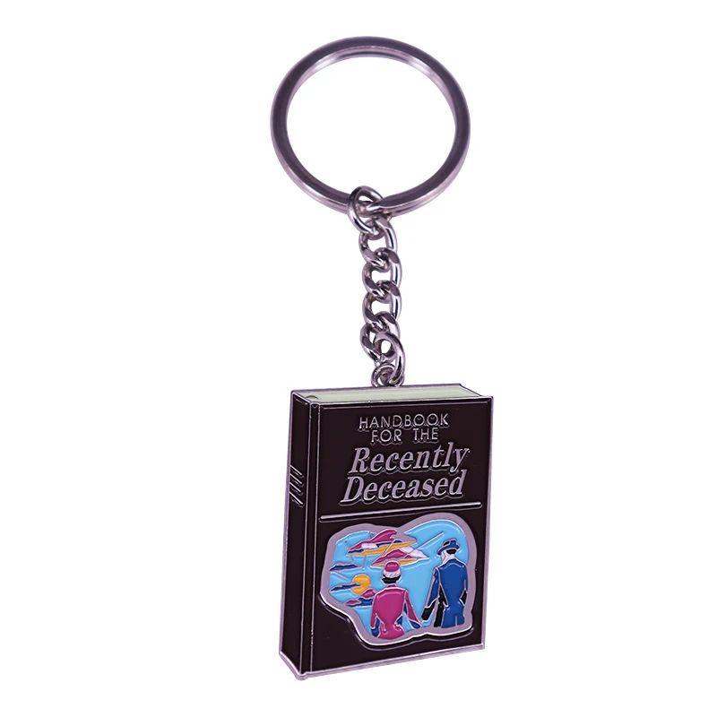 Tim Burton Betelgeuse Handbook Adam and Barbara movie spooky Gothic jewelry keychain key ring reads like stereo instructions