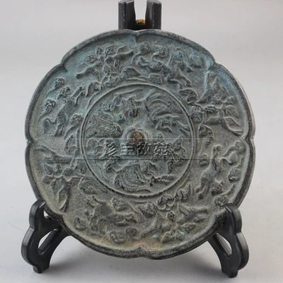 Fine antique bronze mirror with animal pattern and lace in Han Dynasty