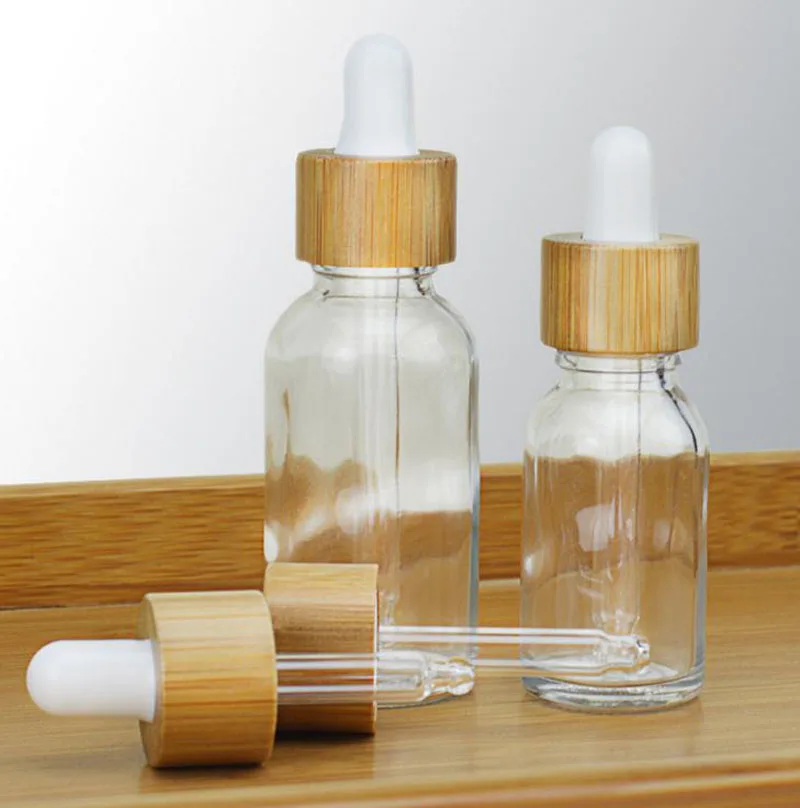 50PCS 5ml 10ml 15ml 30ml 50ml 100ml Custom Clear Glass Dropper Bottles Bamboo lids Cover Caps Refillable Pipette Matte Bottles