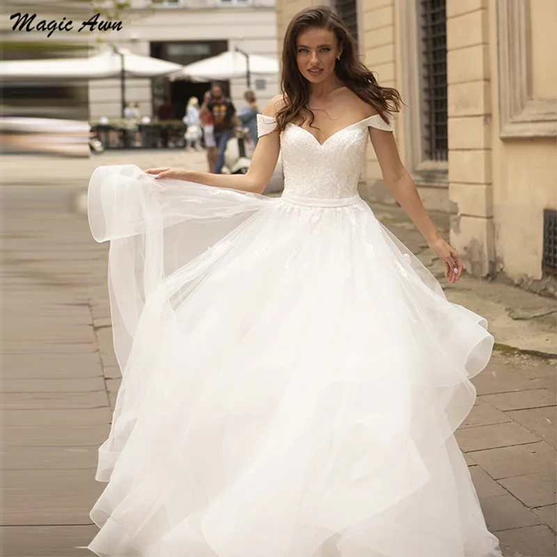 Magiczne Awn nowe suknie ślubne Off The Shoulder 2021 koronkowe aplikacje księżniczka bufiaste suknie ślubne Lace Up powrót Vestidos Branco