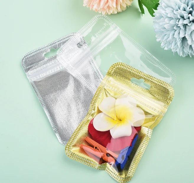 

50pcs 7 * 11 small gold bag composite aluminum gold small bag mobile phone ring buckle packaging bag translucent plastic bag