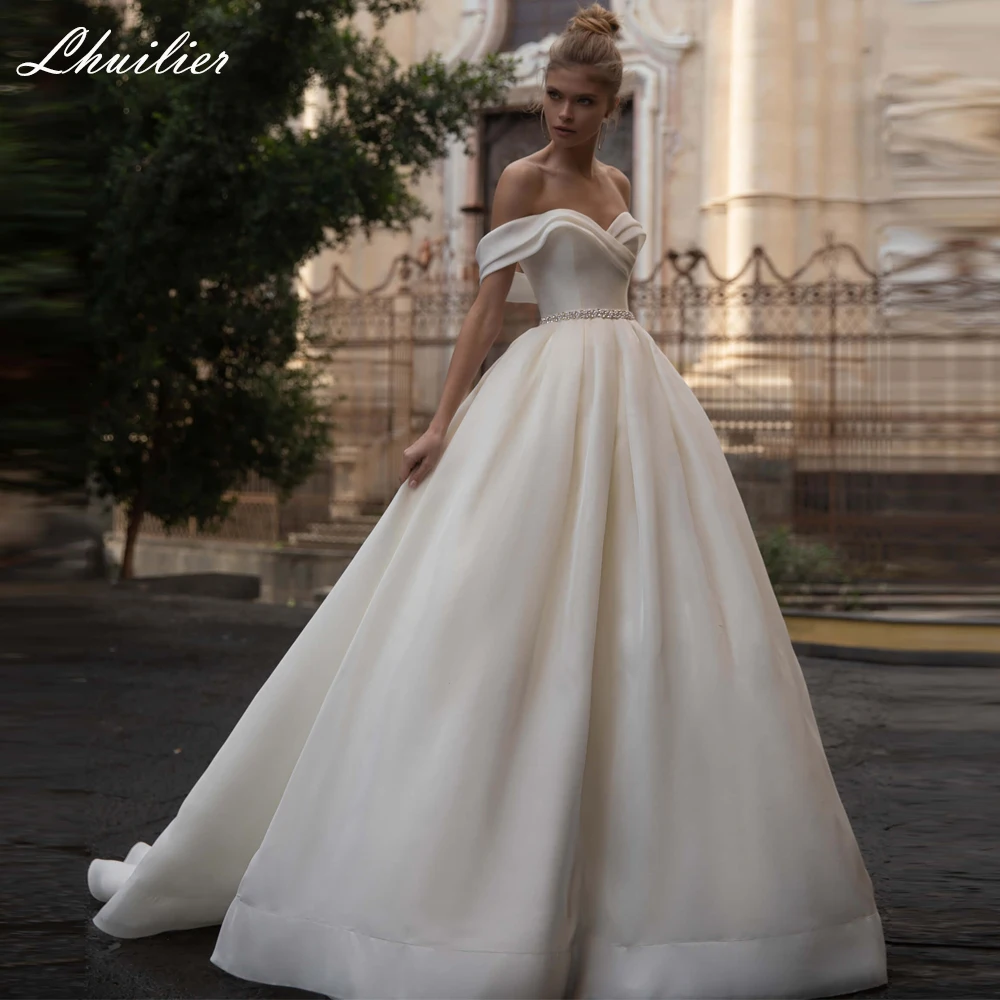

Lhuilier Customized A-line Boat Neck Satin Wedding Dresses Floor Length Off the Shoulder Bridal Dress with Beading Belt