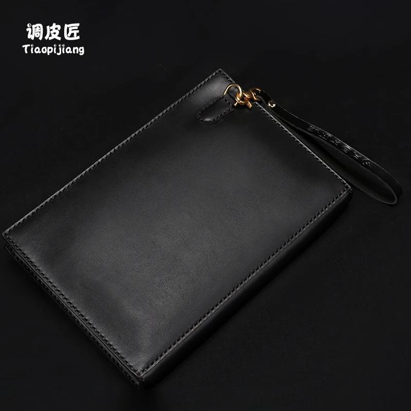 ★Cobbler man new hand bag 2021 hot style leather high-grade small hand clip foreskin carved the envelope bag