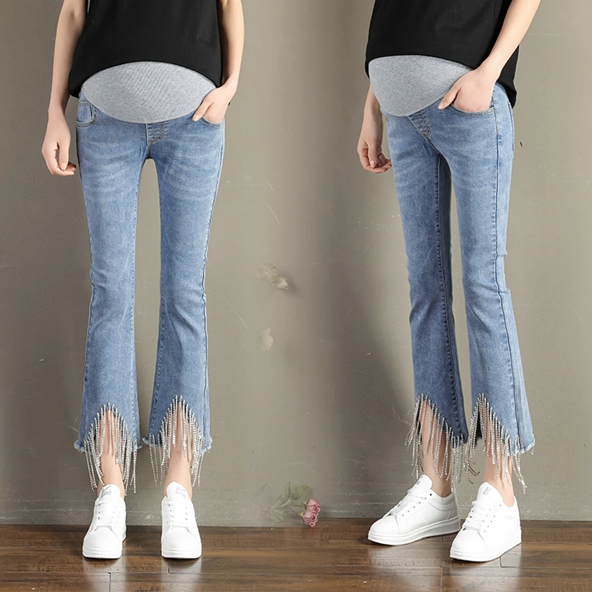 

Pregnant women suit horn iron chain nine points jeans autumn new Korean version of the pants broken micro flared pants women