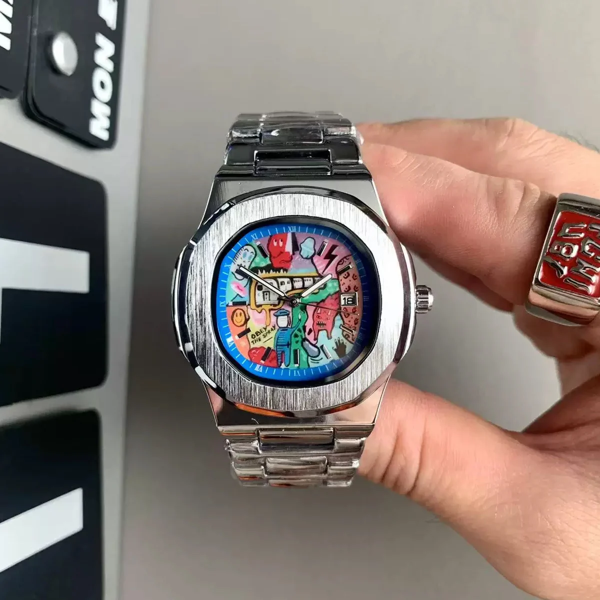 New retro square graffiti watch for men, featuring anime-style pixel graphics on ins, with a high-end and niche look. It has a s