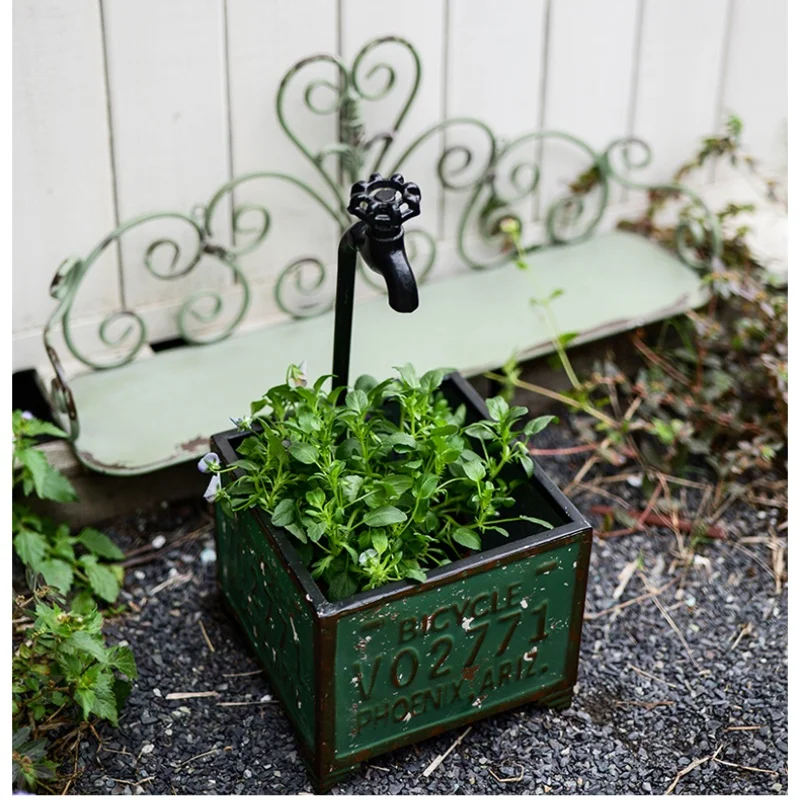 Vintage Iron Faucet with Flower Pots and Unique Design for Garden and Patio Decoration