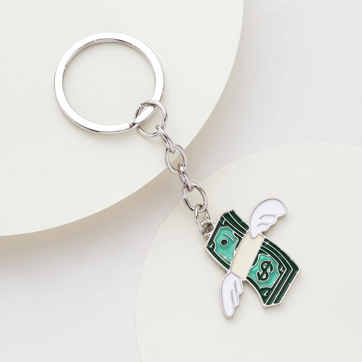 Fashionable Winged Dollar Keychain in Gold-Tone Alloy. A Creative and Symbolic Money Gift Idea for Birthdays and Celebrations.