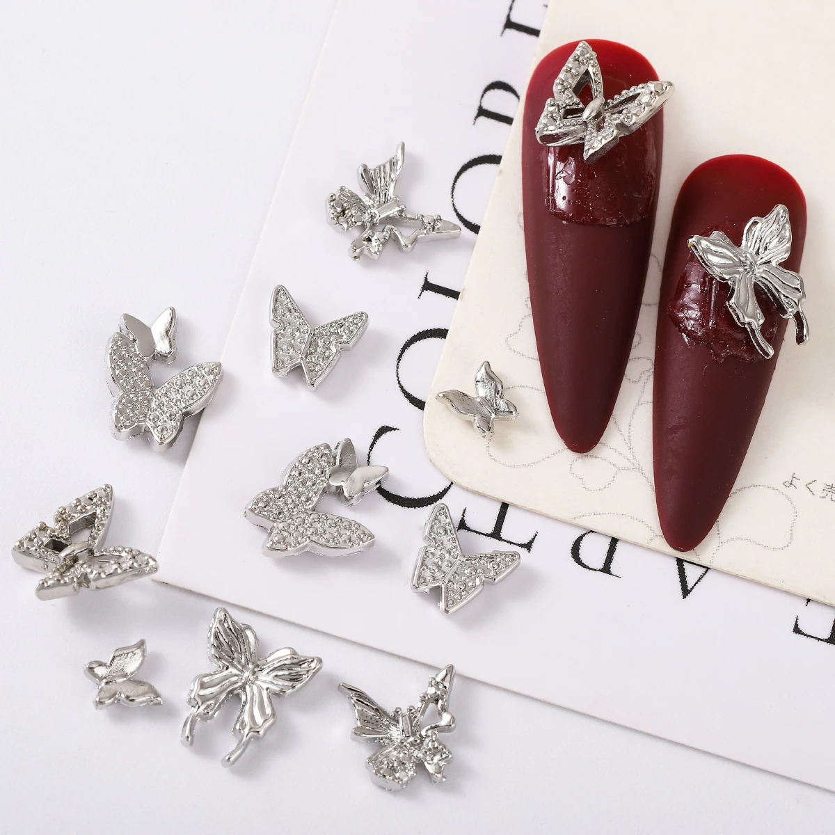 60 uds/1 caja de mini adornos de uñas de mariposa de aleación japonesa ins viento contrajo joker chica decoración artesanal de uñas