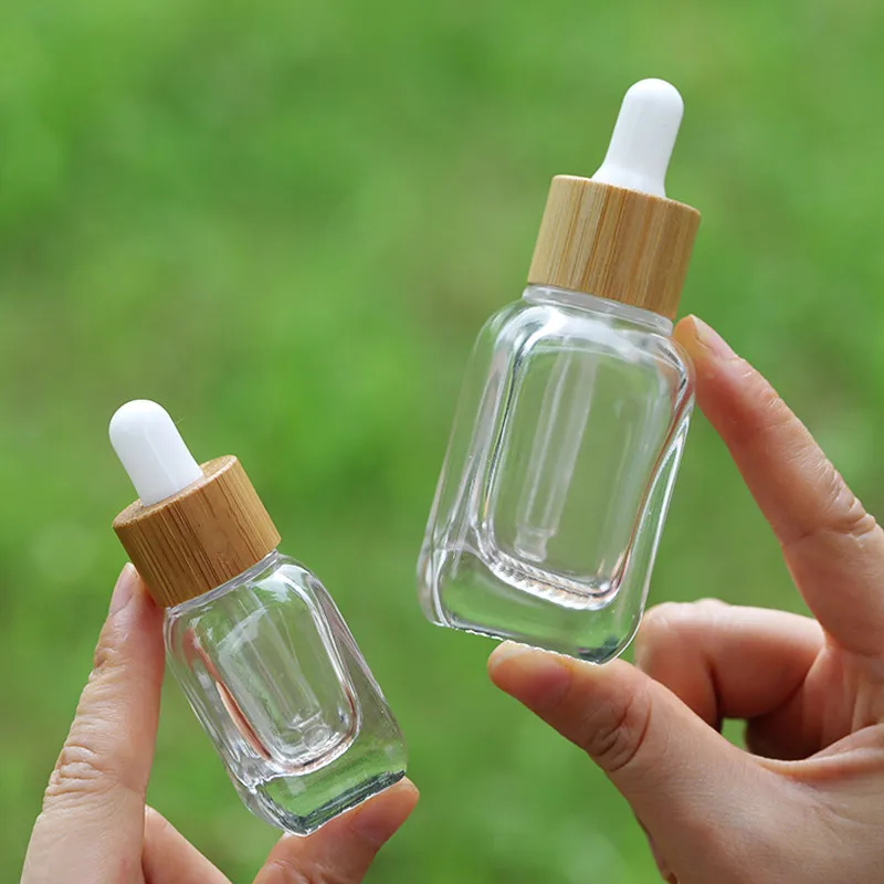 10/15pcs 10ml 30ml garrafas conta-gotas de vidro transparente/rosa com tampa de bambu garrafas vazias de óleo essencial com pipetas de vidro