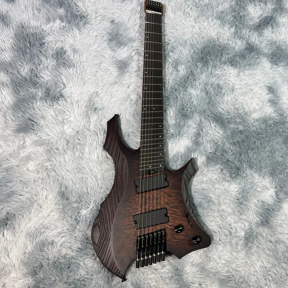 Headless electric guitar, 7-string multi-scale; bone nut; quilted maple top; active pickups; high quality