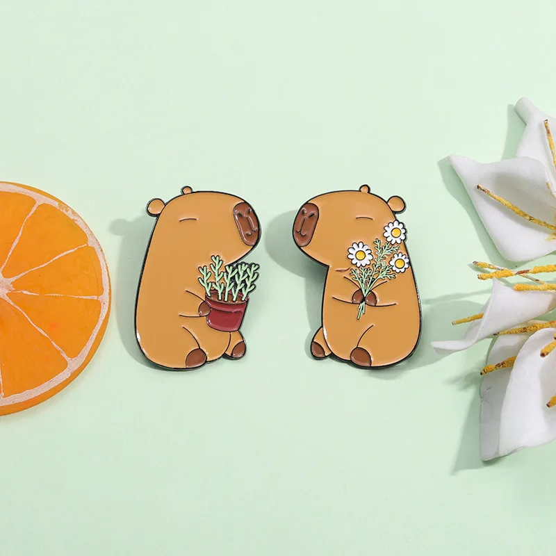 Cute Animal Enamel Pins A cute brooch of two Capybaras holding potted plants and flowers Backpack Accessories Metal Badge Gift