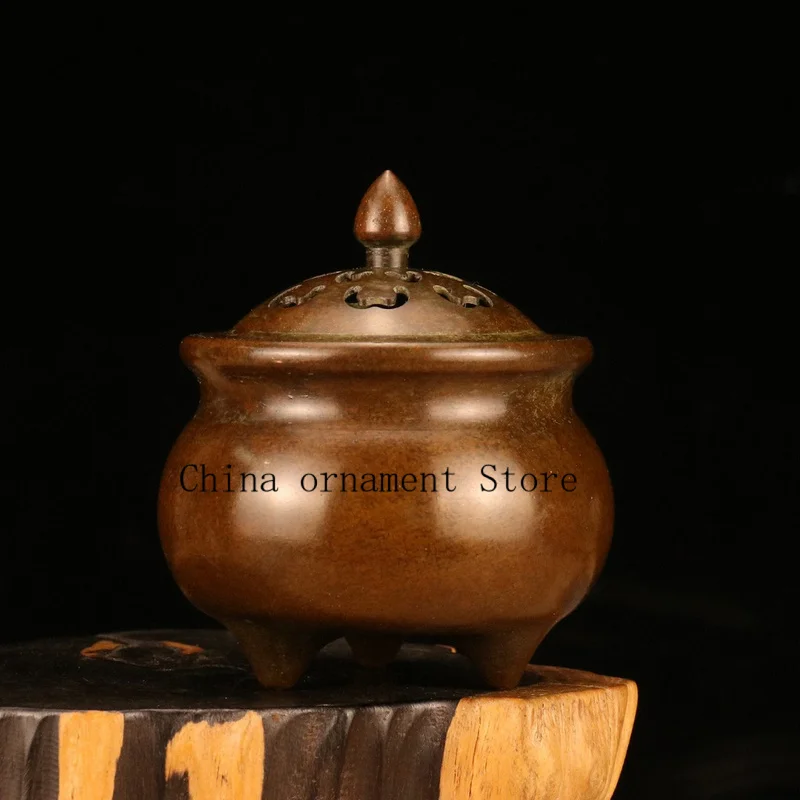 Antique bronze three-legged petal incense burner, a decorative piece for home use, suitable for living rooms, with a retro desig