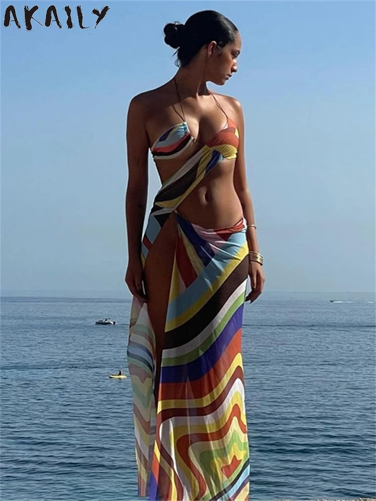 Akaily-Vestido largo ahuecado con estampado colorido para mujer, traje de playa de vacaciones, Irregular, Sexy, transparente, con cuello Halter, 2024