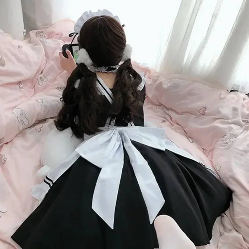 Cosplay ragazza carina Costume nero bianco grembiule vestito Lolita vestito Anime gonna lunga Cafe Costume Cosplay muslimama