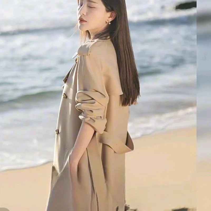 2025 feminino outono e inverno novo emendado gola meio aberta botão bolso moda solta jaqueta corta-vento de comprimento médio