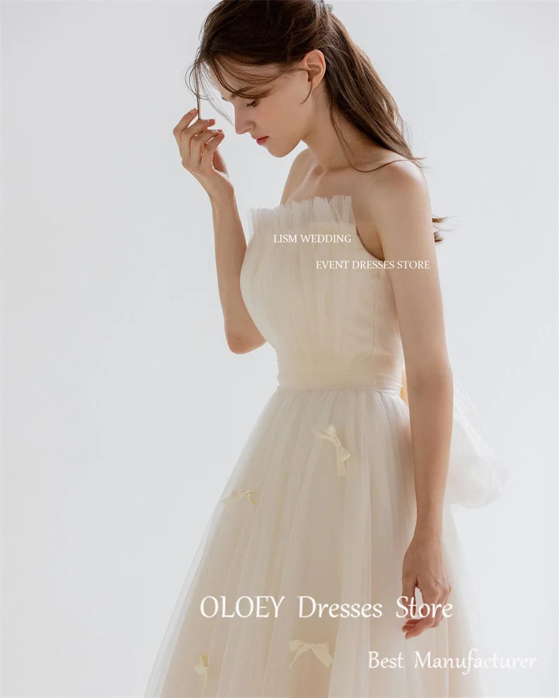 Oloey Fairy Tulle A line เดรสแต่งงานเกาหลีสำหรับถ่ายภาพชุดเกาะอกโบว์ผูกติดอยู่กับสวนชุดเจ้าสาวความยาวตั้งพื้นตามสั่ง