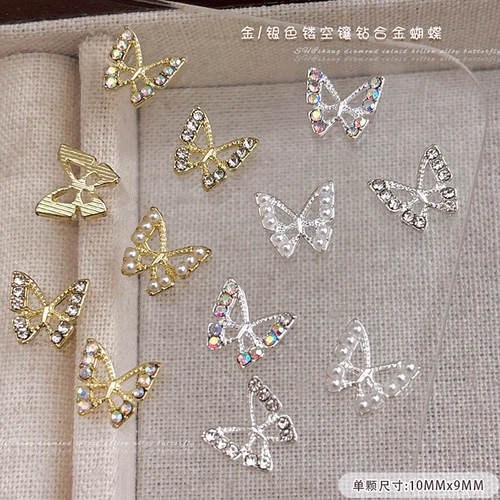 Imagen 1 del producto 10 Uds. De dijes para uñas de mariposa hueca de aleación 3D, diamantes de imitación, accesorios de perlas, piezas para decoración de uñas, materiales