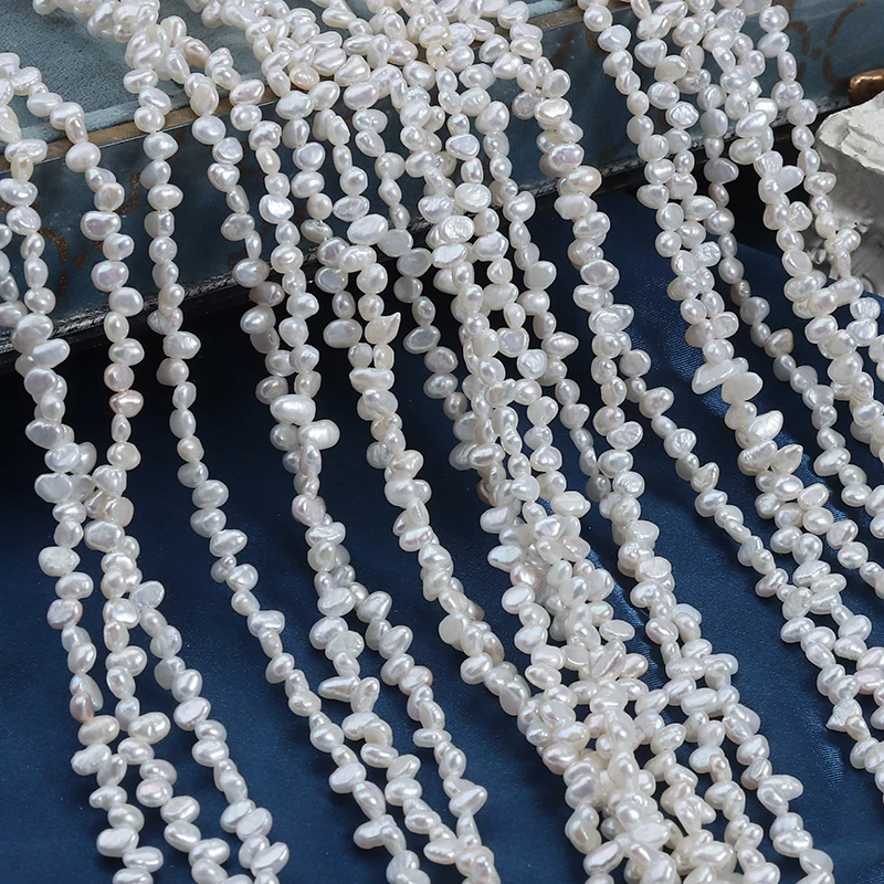 3-4mm mini natural freshwater Sanqi, smooth on both sides, irregular shape, extended length 39cm.