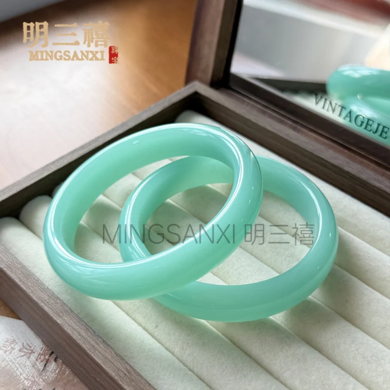 

Wholesale foreign Mongolian material high ice peacock flat chalcedony , aquamarine sky blue agate glass bracelet