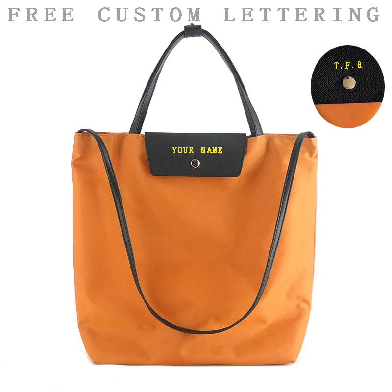 

First layer cowhide spliced ​​waterproof nylon cloth handbag 25 niche design macaron large capacity casual one-shoulder tote bag
