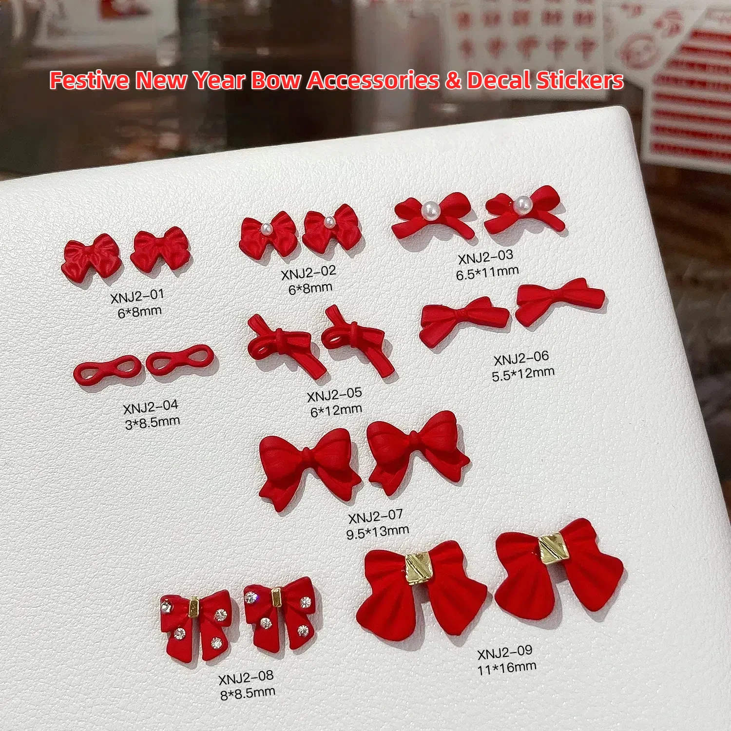 100 stuks Nieuwjaar Rode Matte Boog Nagelaccessoires Strass Parel Nail Art Decoraties Legering Lint manicure Stickers Nagelbedels