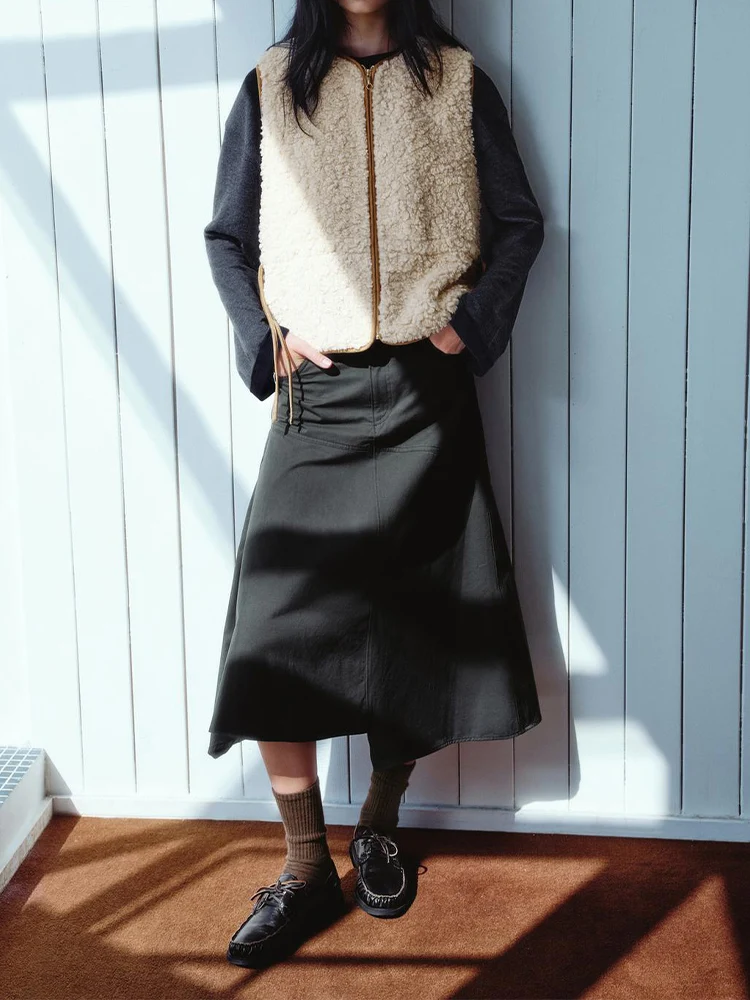 

European style new women's fashion vest/jacket with adjustable waist, bow detail, and lambskin-like fleece lining.