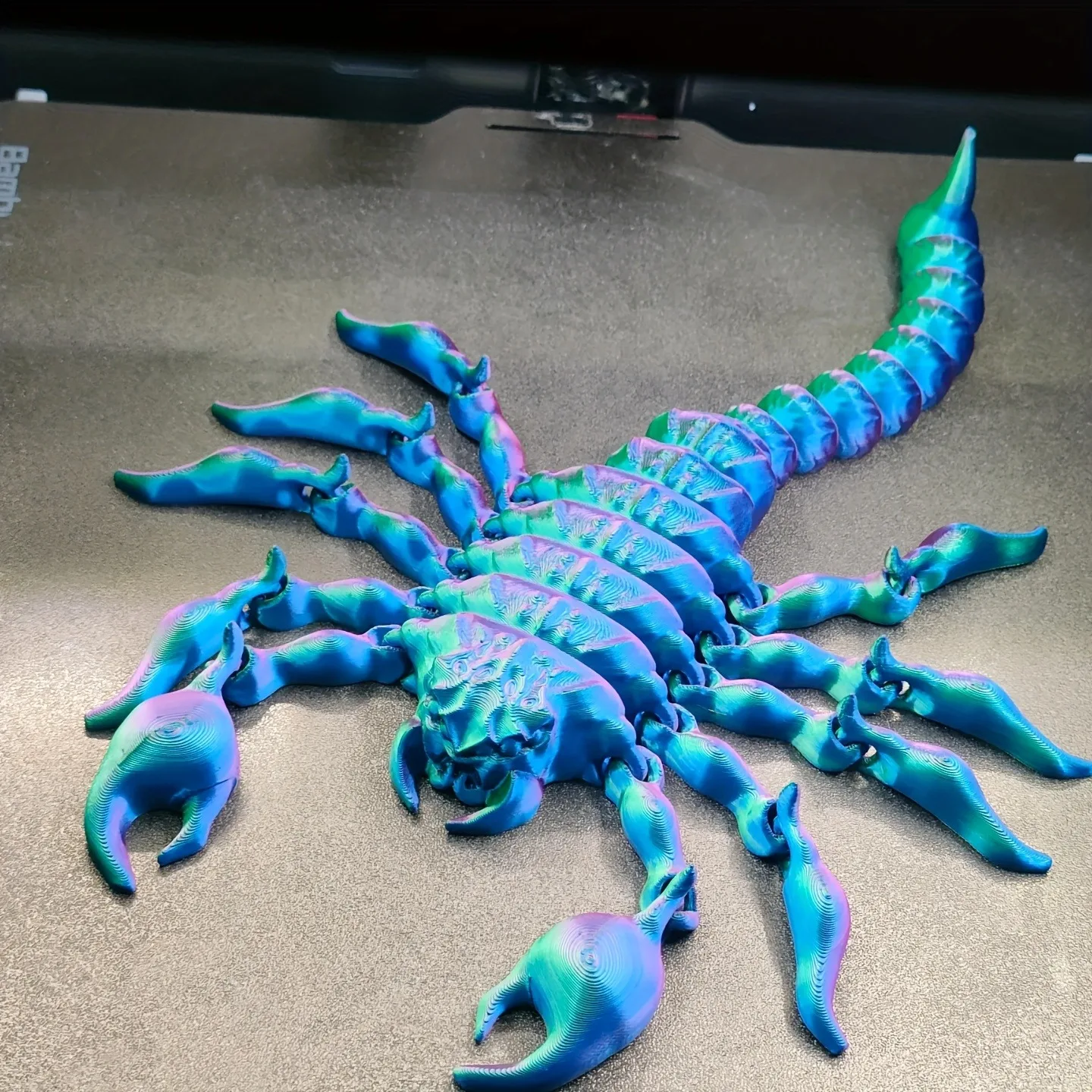 A 3D-printed gradient-colored scorpion figurine, suitable for home decoration or office decoration