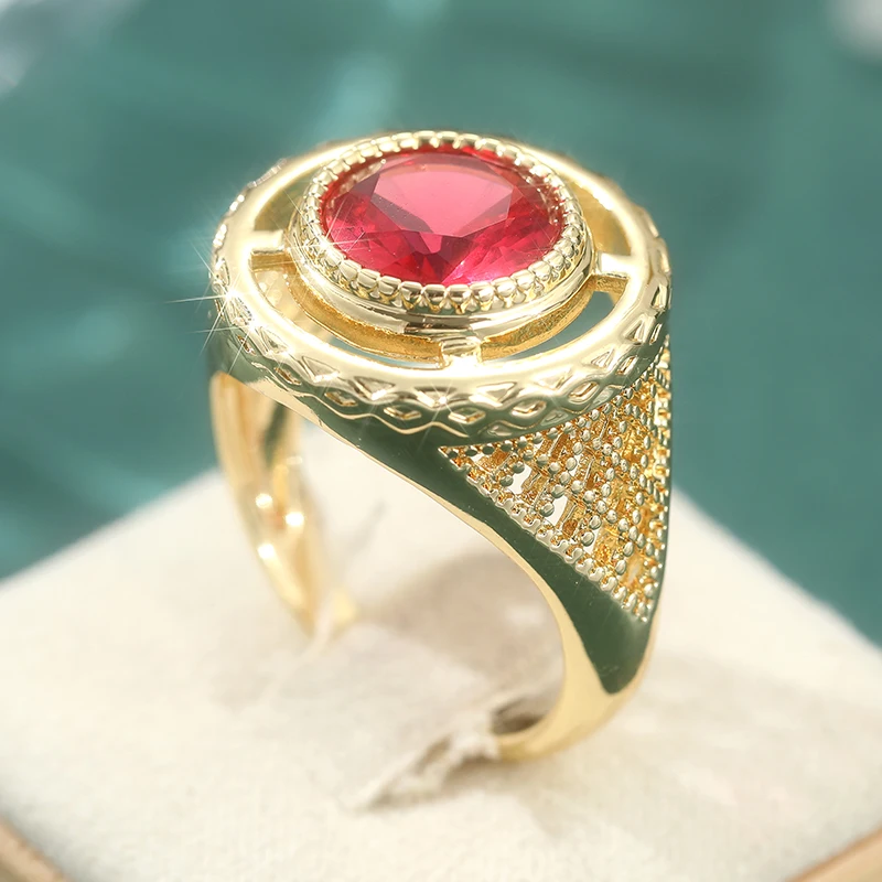 Charm-Ringe in goldener Farbe, ausgehöhlt, rund, für Damen, synthetischer roter Edelstein-Ring, Party, Bankett, Modeschmuck
