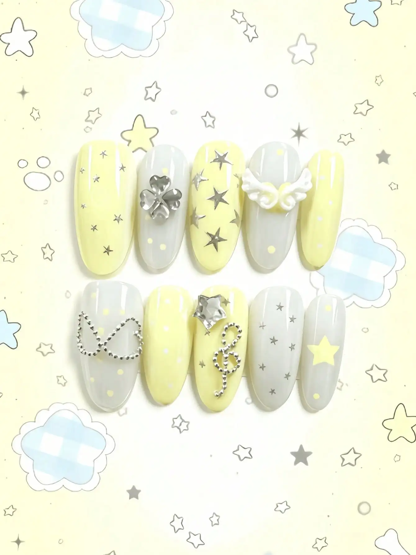 10 Almond-Shaped Medium-Length Press-On Nails in Contrasting Creamy Yellow and Silver White, Featuring Hand-Painted Stars, Musical Notes, and 3D Rhinestones, Angel Wings Elements, in a Sweet and Cool Style, Perfect for Girls, Outings, and Party Occasions, Comes with Jelly Glue and Nail File