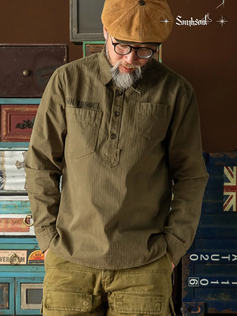 Giacca da camicia pullover con colletto Henry in puro cotone retrò americano a successo, vecchio orlo rotondo asimmetrico lavato a spina di pesce