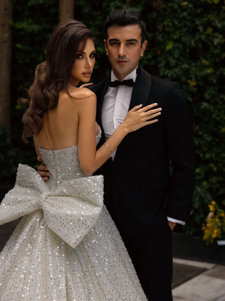 

Strapless A-Line Strapless Dress With Sparkling Sequins And Beading Featuring A Large Bow On The Back For Custom Wedding Dress