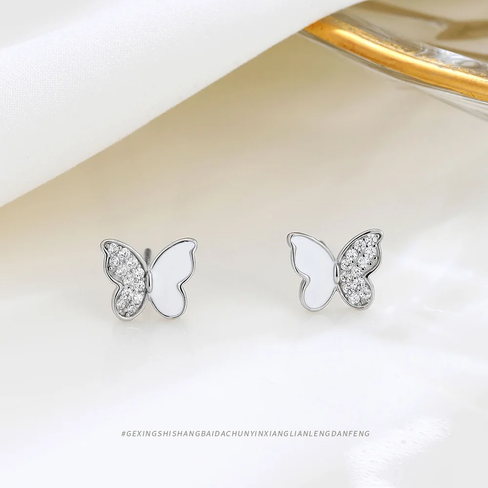 Delicate and Minimalist S925 Silver Butterfly Stud Earrings with Drop Glaze in White, Exuding Elegance and Uniqueness