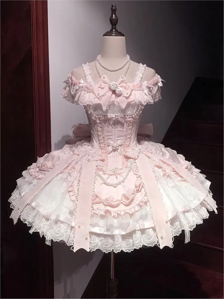 A cute and sweet pink ballet-style birthday dress with cinched waist long tail