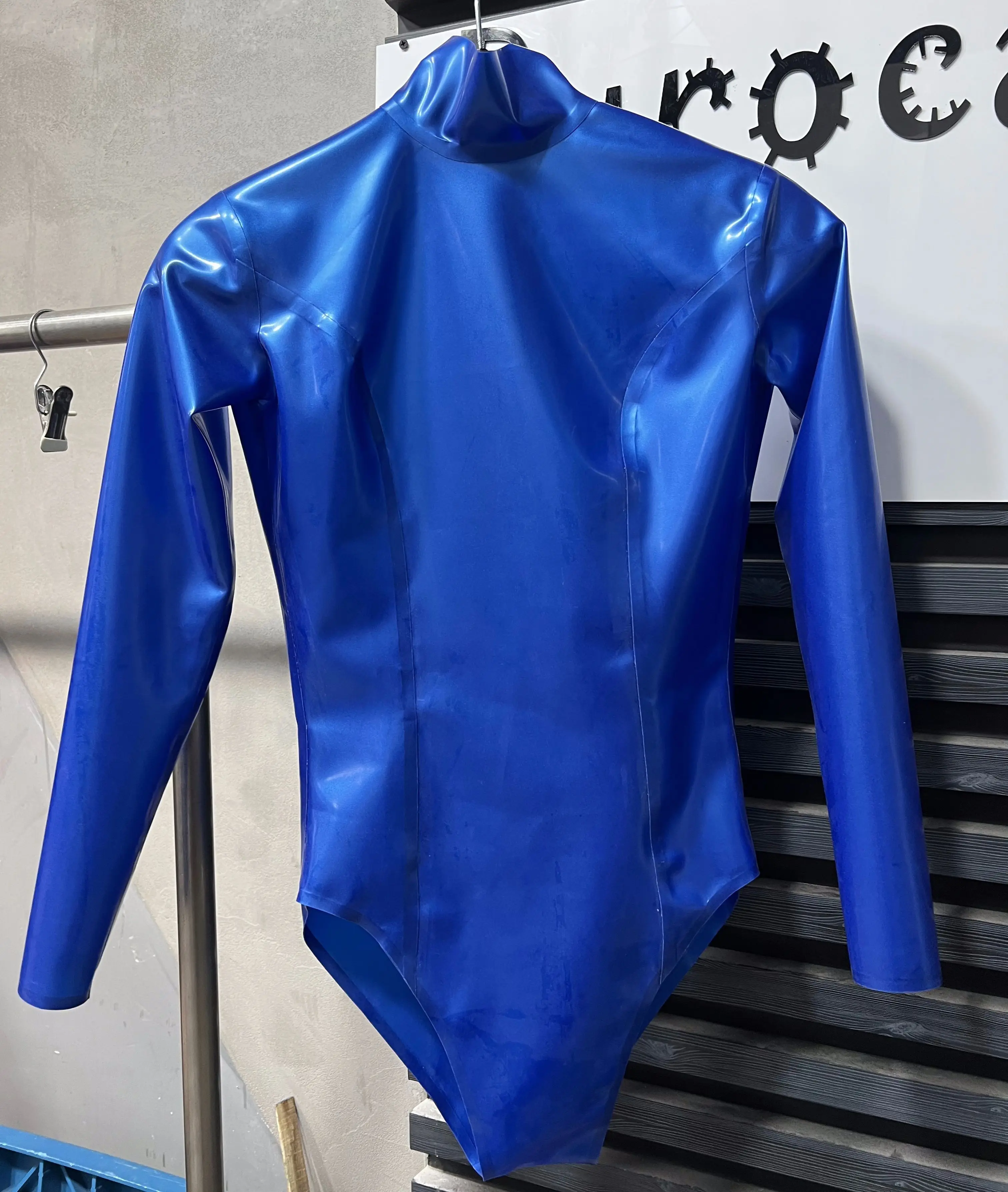 

Latex Jumpsuit Women Blue High Neck Long Sleeve Glossy Finish Front Zipper Tight Fit Rubber Bodysuit Party Wear