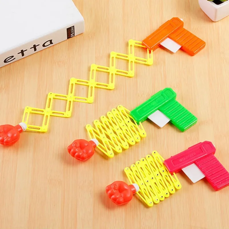 

2 Pack Retractable Telescopic Elastic Fist Shooter Trick Prank Toy Plastic Novelty Festival Birthday Gift for Kids Wholesale Dropshipping
