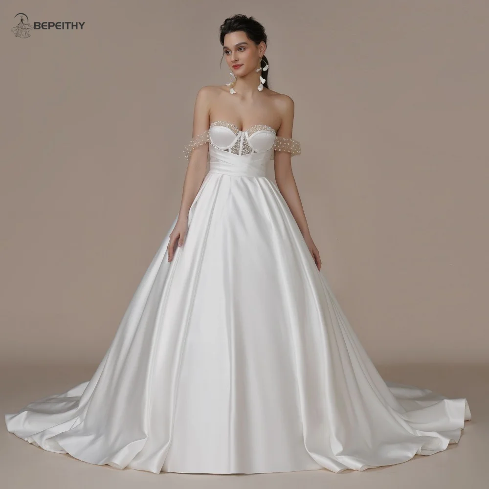 

BEPEITHY Sweetheart Pearls Princess Wedding Dresses 2023 Off The Shoulder Women Ivory White Bride Sleeveless Bridal Gown Vestido