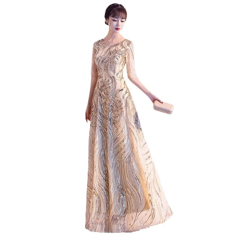 فستان سهرة نسائي جديد لعام 2025 ذهبي لامع برقبة دائرية فستان طويل أنيق ونحيف وأنيق للاجتماع السنوي وسحاب خلفي