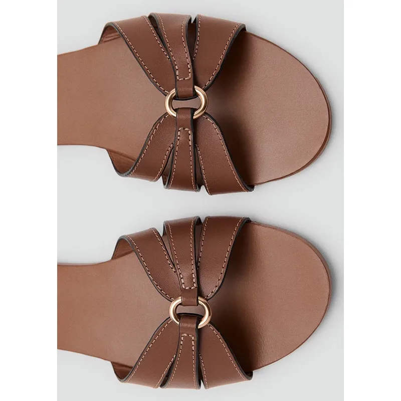 Slippers women's flat bottom 2026 summer new metal buckle beach shoes casual flat heel one word cool slippers women's outer wear