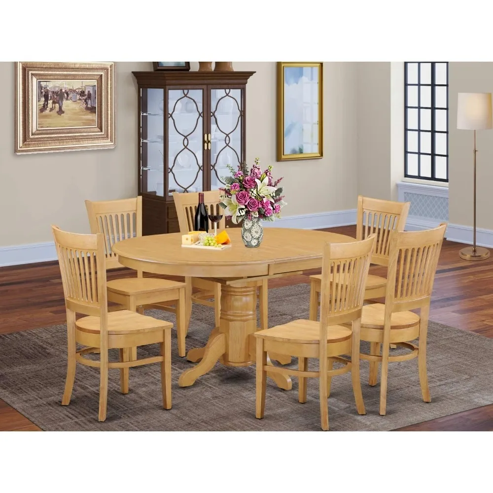 The AVVA7-OAK-W Avon 7-Piece Room Furniture Set includes an oval kitchen table with butterfly leaves and 6 oak dining chairs