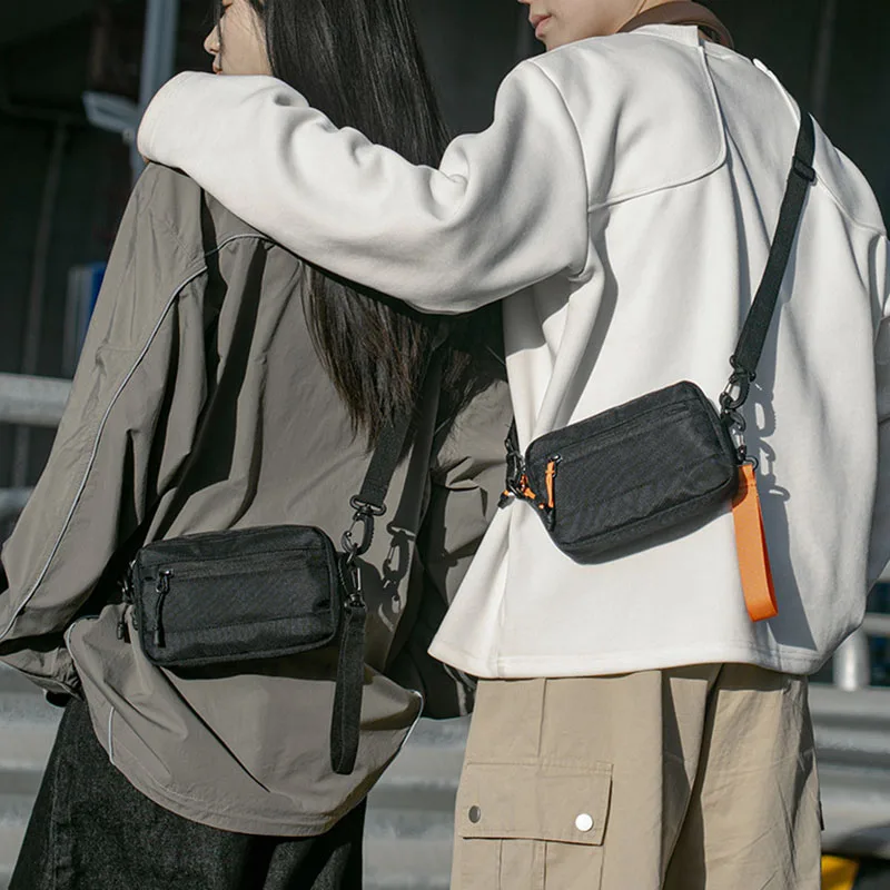 حقيبة كتف صغيرة كلاسيكية للرجال محفظة للعملات المعدنية محمولة للرجال خفيفة الوزن من النايلون حقائب كروس صغيرة للرجال حقائب هاتف ترفيهية