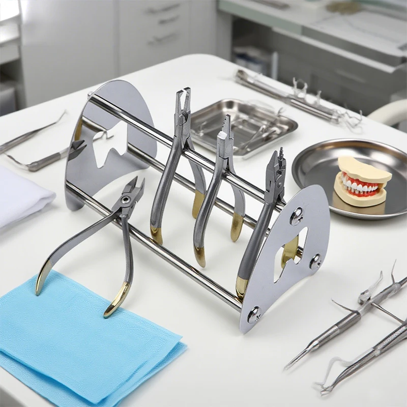 

1 коробка, стоматологическая подставка из нержавеющей стали, ортодонтические плоскогубцы, держатель, щипцы, рама, крепление, подставка, стойка для размещения, стоматологический инструмент