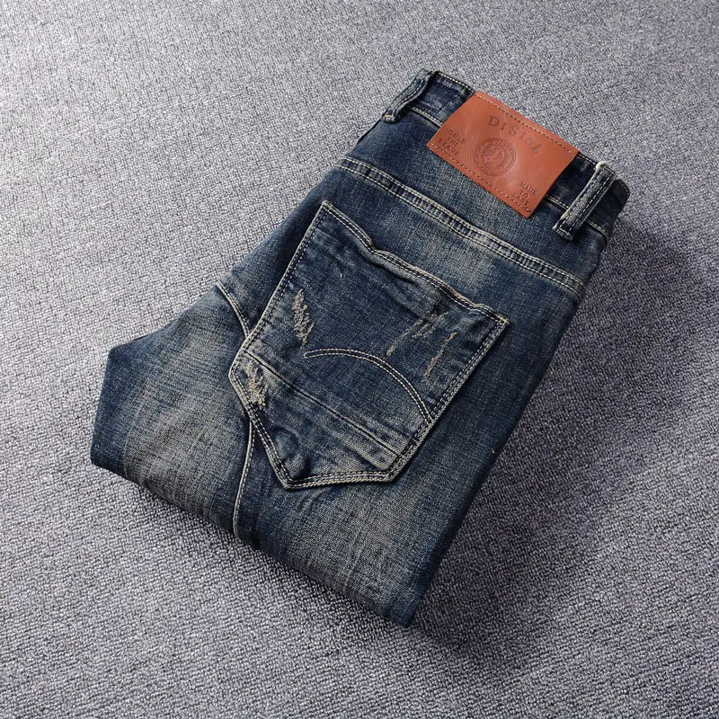 Jeans da uomo di moda di strada Jeans strappati slim fit elasticizzati retrò neri blu di alta qualità Pantaloni in denim vintage di design impiombati da uomo