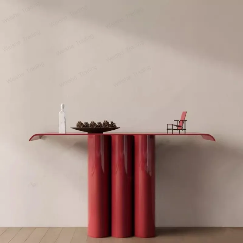 

living room is opposite the door, entrance table is minimalist, and the wall is against the ultra-narrow entrance table.