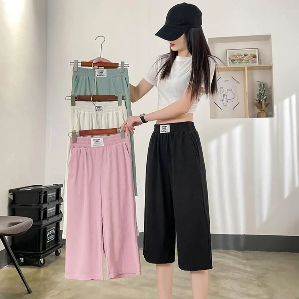 

Women Cropped Pants Streetwear Summer Ice Silk Cropped Pants with Elastic Waist Pockets Loose Fit Wide Leg Mid-calf Length Pants