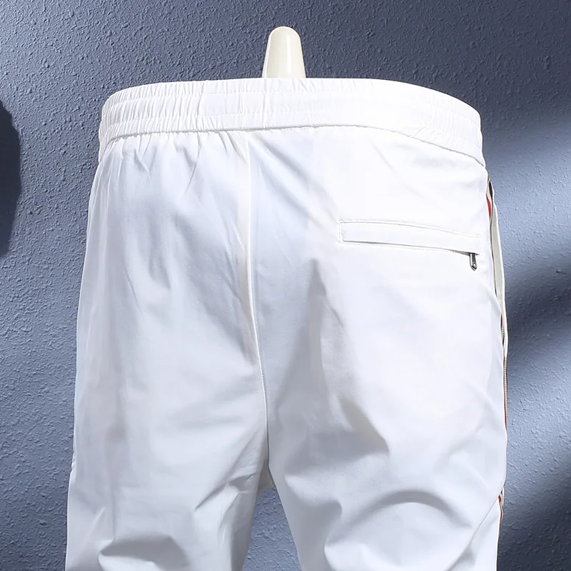 

Summer thin ice silk cool breathable quick drying elastic slim fit ankle binding casual pants for men, light luxury sports pants