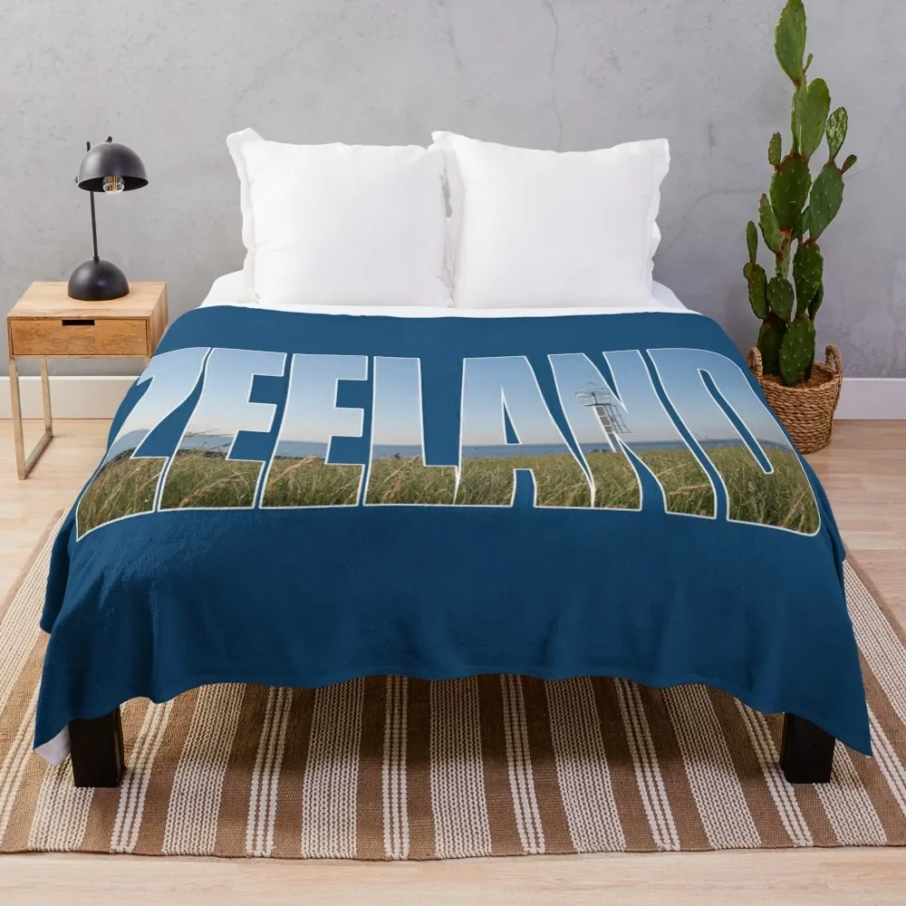 Text Zeeland with overlay of a land and sea landscape in a photo of zeeland in the Netherlands Throw Blanket