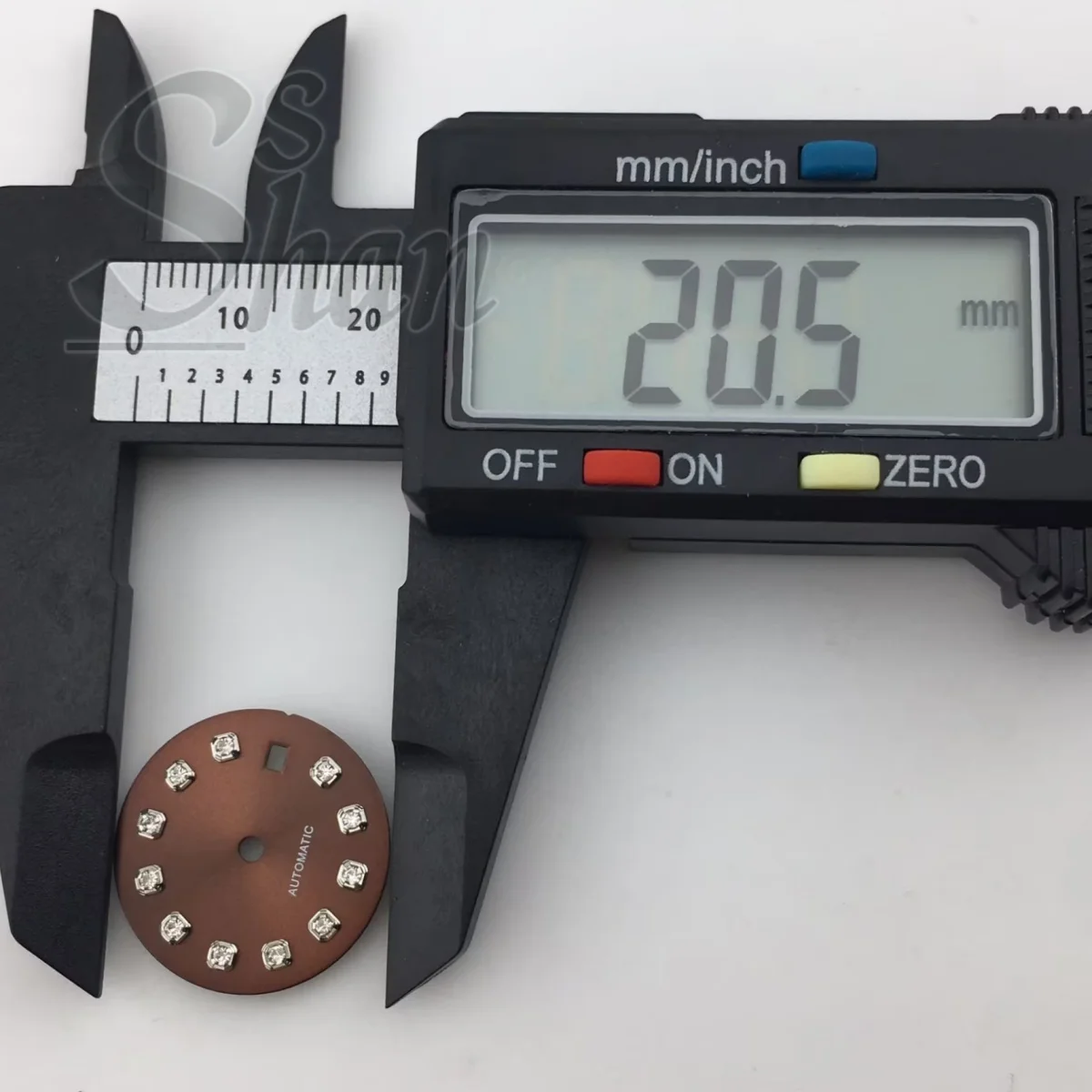 NH05 20.5mm dial with gold silver rose gold diamond indices is paired with a 26mm NH05 movement component a brown sunburst dial