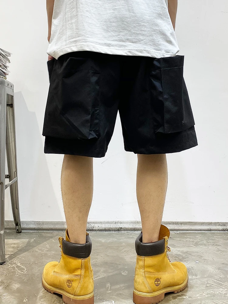 Letnie koreańskie modne duża kieszeń szorty Cargo męskie ubrania japońska moda uliczna wysokiej jakości nylonowe spodnie luźne w stylu Casual