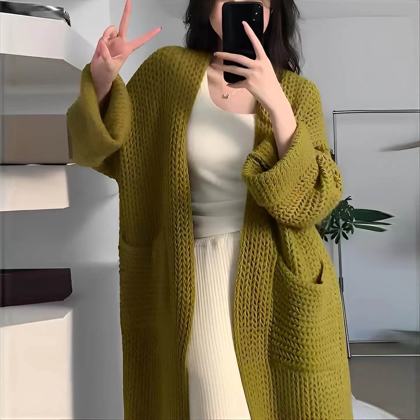 Close-up textile detail revealing grid pattern transparency and faux fur trim attachment at neckline